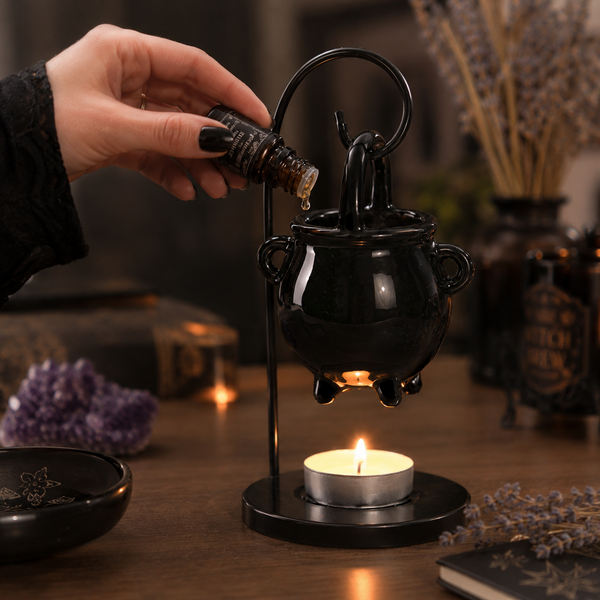 Black gothic fragrance holder displayed on a mantelpiece