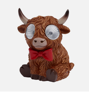 Highland cow solar decoration displayed outdoors