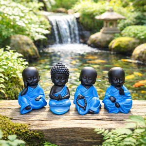 Blue Buddha ornaments displayed on a windowsill