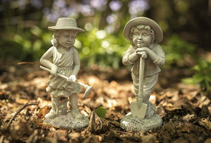 Resin boy and girl garden sculpture set