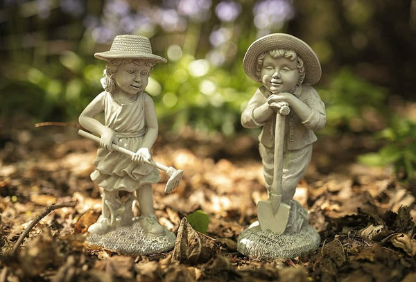 Resin boy and girl garden sculpture set