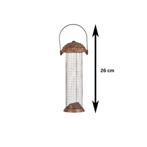 Metal peanut bird feeding station hanging in a garden