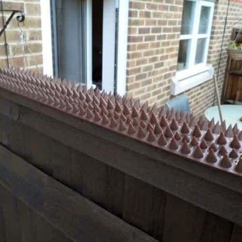 Brown fence and wall security spike set