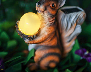 LED squirrel ornament creating a soft evening glow