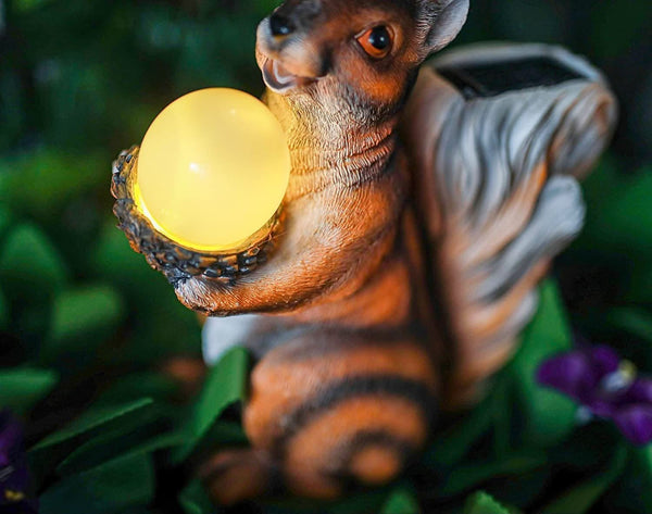 LED squirrel ornament creating a soft evening glow