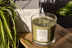 Three wick scented candle displayed in a living room