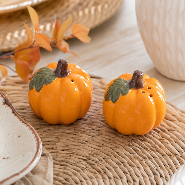 Ceramic pumpkin seasoning set displayed in a kitchen