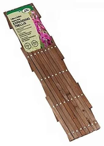Expandable timber lattice mounted on a garden wall