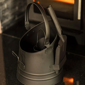 Black metal coal bucket with matching shovel