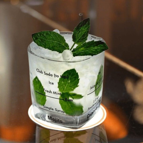 Four cocktail mixing glasses shown from front