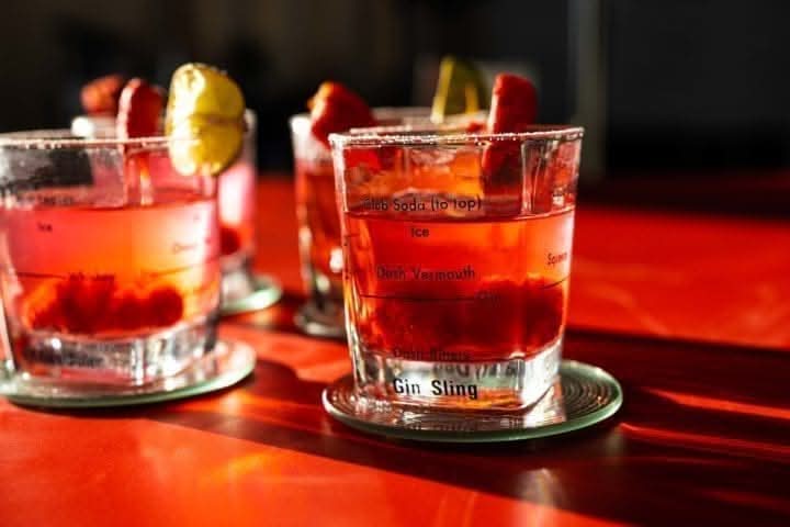 Four piece cocktail glass set with recipe booklet