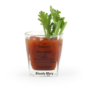 Four cocktail glasses with printed measurements and recipes