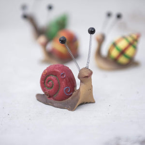 Bright novelty snail ornaments for fairy gardens and patios