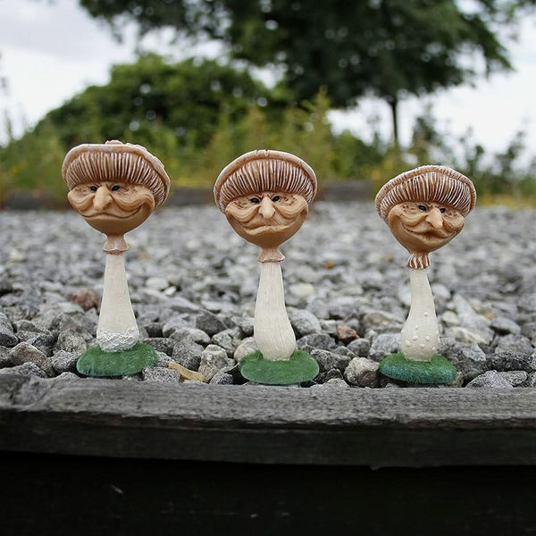 Miniature mushroom decorations shown together outdoors