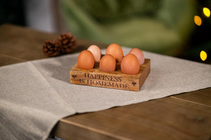 Compact wooden egg organiser for countertop.