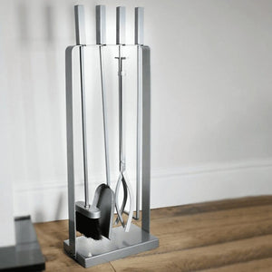 Antique silver fireplace tools displayed together
