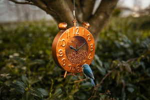 Copper clock bird feeder with vintage garden design