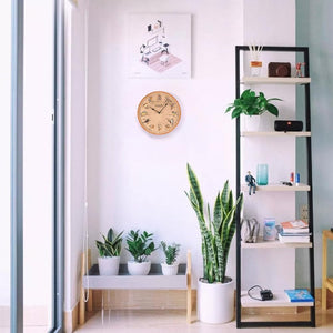 Hand-painted resin outdoor clock with temperature display.