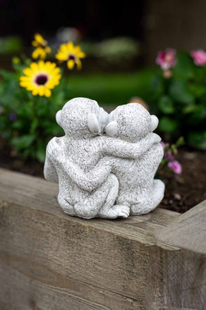 Weatherproof resin monkeys positioned on a patio