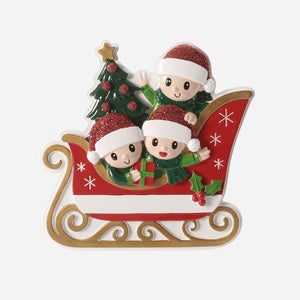 Decorative Christmas ornament with three elves on a sleigh, featuring a tree and presents.