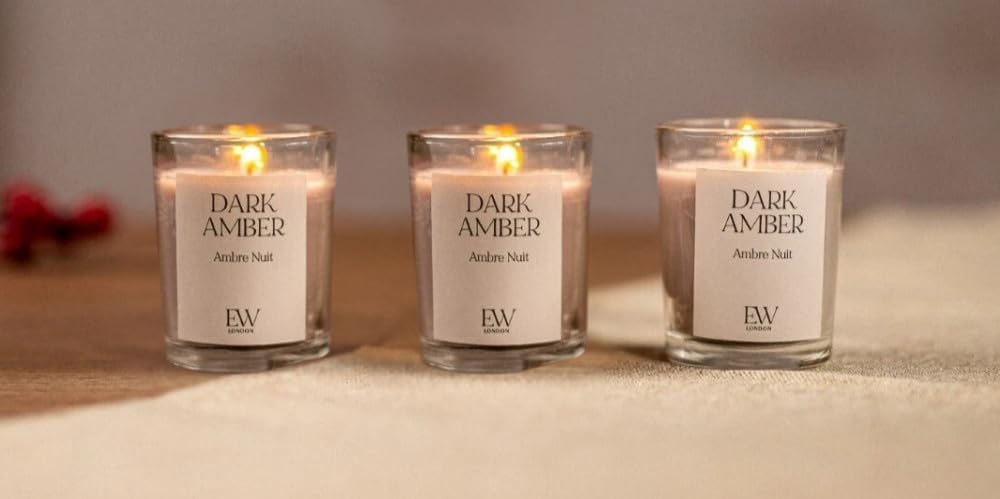 Dark amber scented soy wax candle in glass