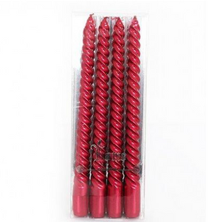 Pack of red twisted candles in clear packaging on a white background