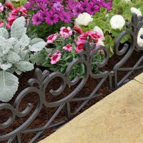Decorative metal garden border with flowers