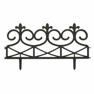 Decorative metal headboard with intricate designs on a white background