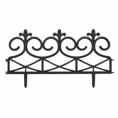 Decorative metal headboard with intricate designs on a white background