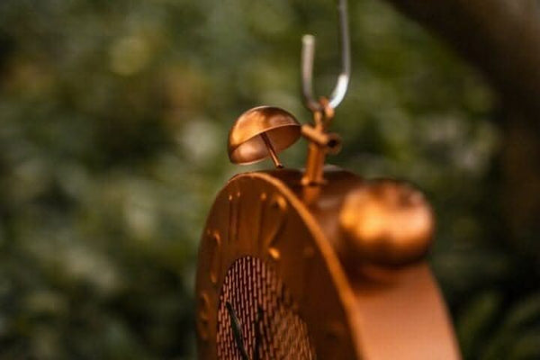 Rustic metal bird feeder with clock design