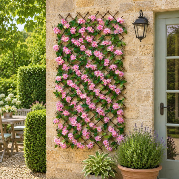 Expandable faux pink blossom trellis on willow lattice