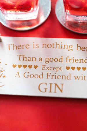 Humorous friendship plaque displayed on a coat hook