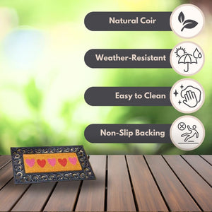 Heart-pattern coir doormat for indoor and outdoor use.