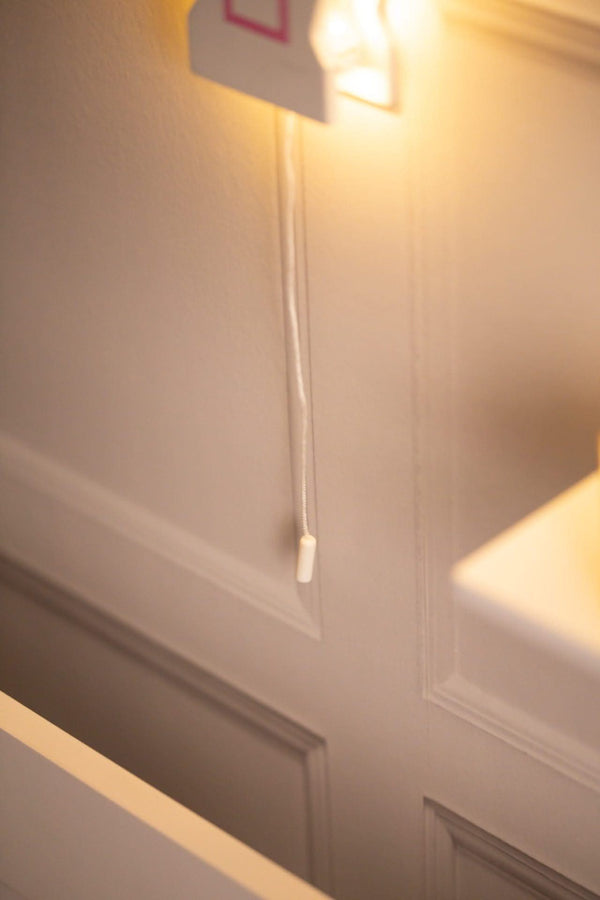 White wooden wall light with pink hot air balloon details