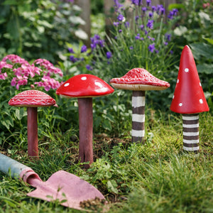Red toadstool decorations used in a miniature garden