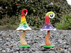 Colourful mushroom statues for flower beds