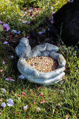 Decorative stone effect bird bath with open hands