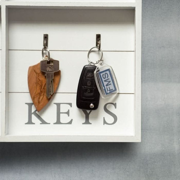 Wooden wall organiser displaying family photos