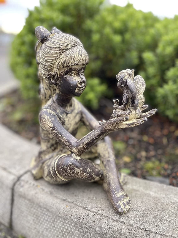 Waterproof resin garden statue displayed beside a pond