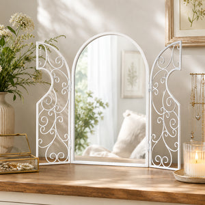 Vintage white mirror featuring an arched top