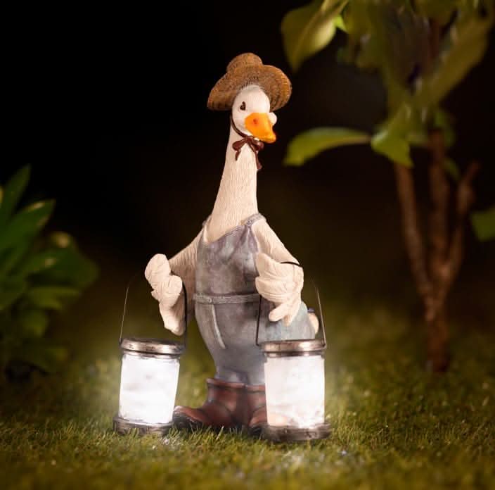 Solar duck garden ornament with glowing LED lanterns
