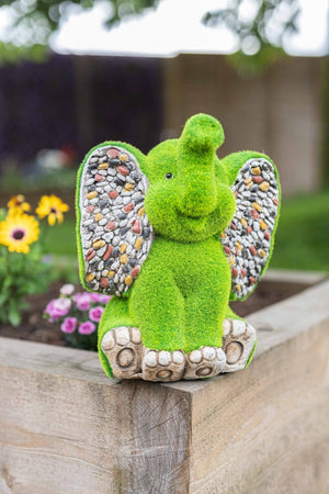 Resin elephant ornament with artificial grass finish