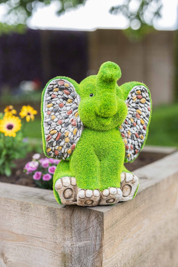 Resin elephant ornament with artificial grass finish