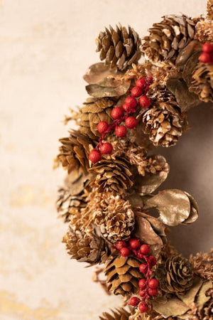 Festive scented wreath hanging in a cosy indoor space
