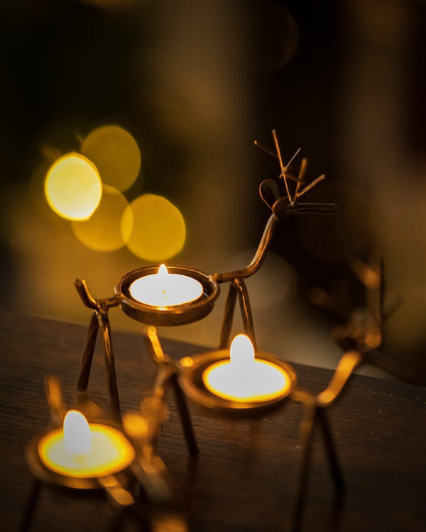 Antique brown reindeer candle decoration shown close up