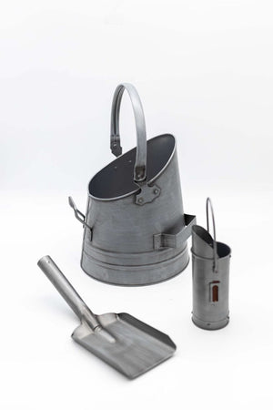 Silver match canister and coal shovel shown together