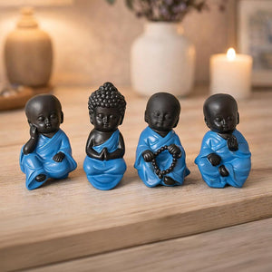 Blue resin Buddha figures arranged on a shelf