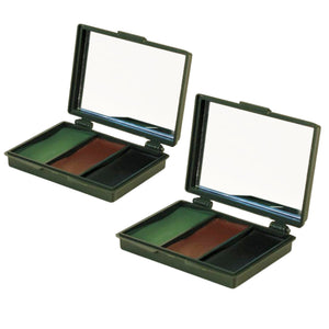 Two open camouflage makeup palettes with mirrors, showing green, brown, and black color blocks in dark olive green cases on a white background.