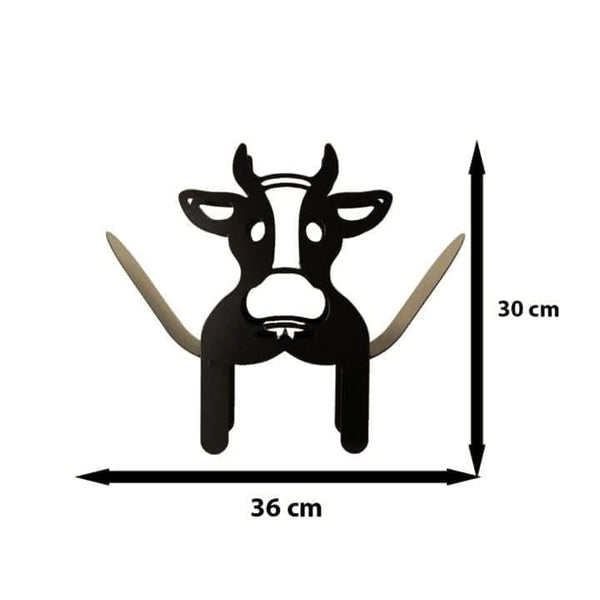 Metal cow holder storing spare toilet rolls