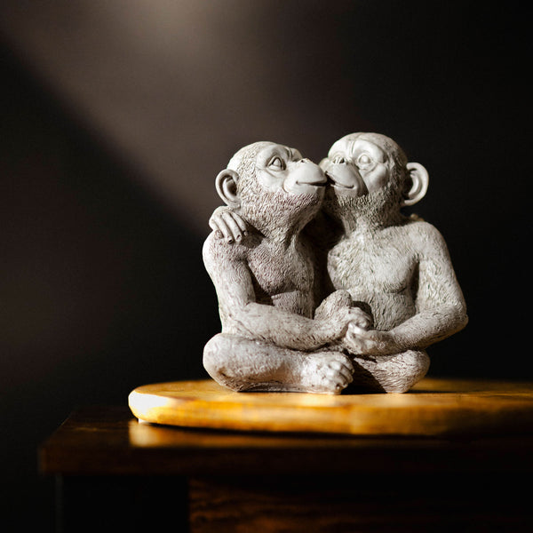 Quirky monkey garden decoration shown from the side